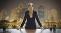 Female business woman looking out the windows for night busin