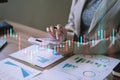 Female businessman working with holding a pen and using a calculator to calculate the numbers of static at home office. Finance Royalty Free Stock Photo