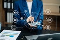 Female businessman working with holding a pen and using a calculator to calculate the numbers of static at home office. Finance Royalty Free Stock Photo