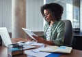 Female businesswoman analyzing the business report in the office