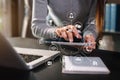 Female businesswoman or Designer using tablet with laptop on desk at home office . Royalty Free Stock Photo