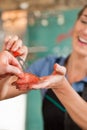 Female Butcher Selling Fresh Meat to Customer Royalty Free Stock Photo