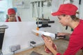 Female butcher slicing meat