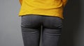 Female butt or bottom wearing black denim jeans