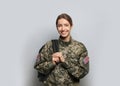 Female cadet with backpack on light grey background. Military education Royalty Free Stock Photo