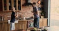 Female cancer patient celebrate remission dancing with husband in kitchen