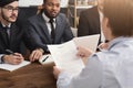 Female candidate holding resume during interview Royalty Free Stock Photo