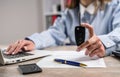 female car dealer explaining the conditions purchase or rent car at office Royalty Free Stock Photo