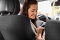 female car driver takes credit card from passenger Royalty Free Stock Photo