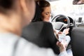 female car driver taking money from passenger Royalty Free Stock Photo