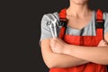 Female car mechanic with tools on black background, closeup Royalty Free Stock Photo