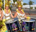 Female Carnival drummers in Flamboyant Yellow Costumes.