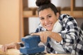 Female carpenter sanding wood Royalty Free Stock Photo