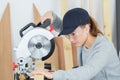 Female carpenter using circular saw Royalty Free Stock Photo