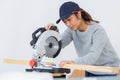 Female carpenter using circular saw Royalty Free Stock Photo