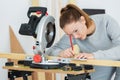 Female carpenter using circular saw Royalty Free Stock Photo