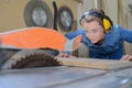 Female carpenter using circular saw Royalty Free Stock Photo