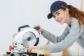 Female carpenter using circular saw Royalty Free Stock Photo