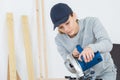 female carpenter using circular saw Royalty Free Stock Photo