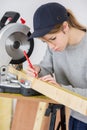 Female carpenter using circular saw Royalty Free Stock Photo