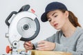 female carpenter using circular saw for wood Royalty Free Stock Photo