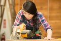 Female carpenter using circular Saw Royalty Free Stock Photo