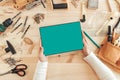 Female carpenter using digital tablet computer, mock up screen Royalty Free Stock Photo