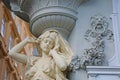 Female caryatid detail with a decorative pillar and ornamental reliefs. Detail at Jugendstil house in the Graben street in the Royalty Free Stock Photo