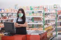 Female cashier standing at cash counter Royalty Free Stock Photo