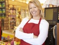 Female Cashier At Supermarket Checkout Royalty Free Stock Photo