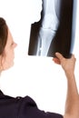 Female Caucasian doctor examining an x-ray Royalty Free Stock Photo