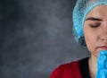 female caucasian doctor praying with head in hands. Royalty Free Stock Photo