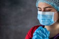 female caucasian doctor praying with head in hands. Royalty Free Stock Photo