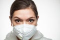 Female caucasian medical worker wearing PPE N95 face mask and protective suit,closeup portrait Royalty Free Stock Photo