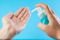 Female caucasian person applying dry wash antibacterial sanitizer gel on hands