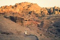 Female caucasian tourists walk around the Petra ruins with famous Al-Khazneh The Treasury
