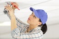 female cctv installer checking security camera Royalty Free Stock Photo