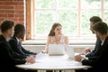 Female CEO explaining business strategy to male subordinates Royalty Free Stock Photo