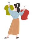 Shopping woman choosing clothes on hanger in store Royalty Free Stock Photo