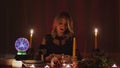 Female charlatan Witch or fortune teller can`t lights a candle for rituals