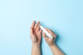 Female checking blood sugar level on background