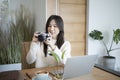 Female checking picture previews on her camera. Royalty Free Stock Photo