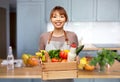 female chef with food in wooden box in kitchen Royalty Free Stock Photo