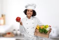 female chef with food in wooden box in kitchen Royalty Free Stock Photo