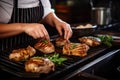 female chef garnishing grilled pork chops