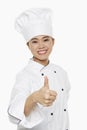 Female chef giving thumbs up Royalty Free Stock Photo