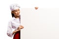 Female chef holding a poster for text