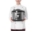 Female chef with modern multi cooker on white background Royalty Free Stock Photo