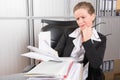 Female chef in the office with too much work Royalty Free Stock Photo