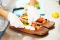 Female chef portrait decorating fish plate